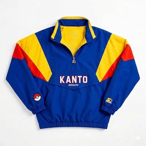 May include: A blue, yellow, and red quarter-zip pullover jacket featuring the text KANTO REGION in white with a red outline on the chest. The jacket includes a small Poké Ball graphic on the right sleeve and a Starter logo on the left cuff.