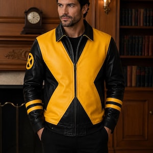 May include: A black and yellow leather jacket featuring a prominent X-shaped design on the front, a black collar, and a circular yellow and black X-Men logo patch on the right sleeve. The sleeves have two horizontal yellow stripes near the cuffs.