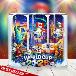 May include: A stainless steel tumbler featuring a colorful design for the 2026 World Cup. The design includes the Statue of Liberty, the CN Tower, and the Empire State Building, along with soccer balls and flags. The text "WORLD CUP 2026" is prominently displayed.