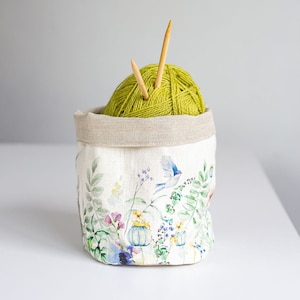 Storage basket with meadow print.