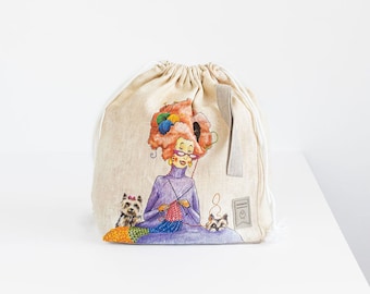 Grande bolsa para projetos de tricô com cordão e estampa de tricô.