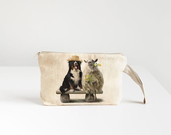Linen Wristlet pouch with sheep and dog print.