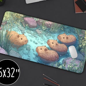 May include: A rectangular mouse pad with a whimsical illustration of capybaras swimming in a pond. The pad measures 16 x 32 inches and features a serene aquatic scene with rocks and greenery.
