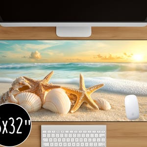 May include: A rectangular mouse mat with a beach scene featuring seashells and starfish on the sand, with a bright ocean and sunset background. The mouse mat measures 40.6 x 81.3 cm.