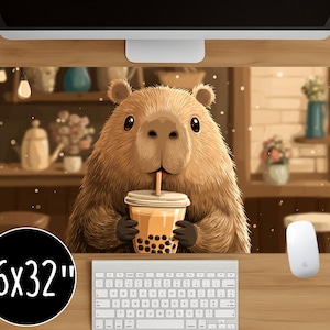 May include: A large rectangular mouse pad featuring a cartoon capybara drinking bubble tea. The pad is 16x32 inches and has a warm, inviting cafe scene background. The capybara is brown with big eyes and is holding a cup of boba tea.