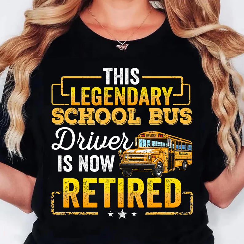 May include: Black t-shirt with a yellow graphic that reads "THIS LEGENDARY SCHOOL BUS Driver IS NOW RETIRED." The graphic includes a yellow school bus illustration and three stars.