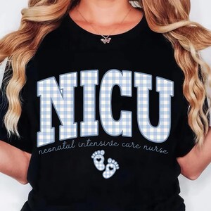 May include: Black t-shirt with the word "NICU" in large, light blue gingham letters. Below the letters, the text reads "neonatal intensive care nurse." Two baby footprints are below the text.