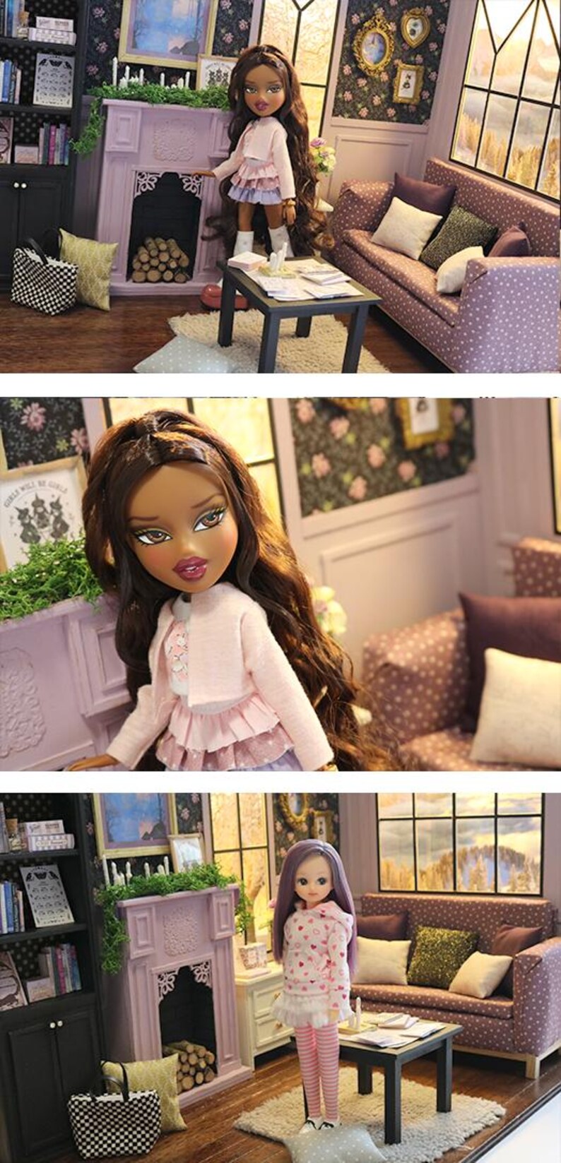 May include: A dollhouse living room scene featuring a doll with long brown hair wearing a pink cardigan and layered skirt, standing near a purple fireplace, a black coffee table, and a purple patterned sofa with various throw pillows.