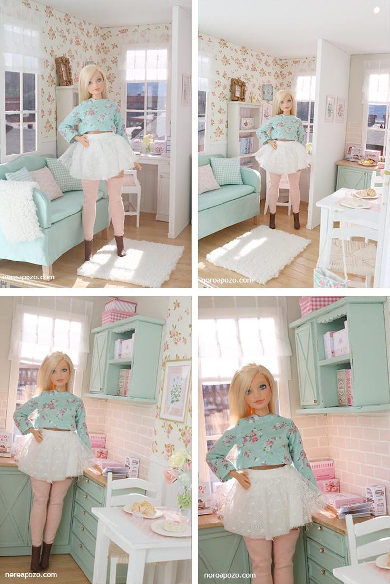 May include: A trio of cream-glazed ceramic mugs with a speckled finish. Each mug is adorned with a hand-painted design: a blue and green leaf, a yellow flower, and a red berry. The mugs have a simple, rounded form.