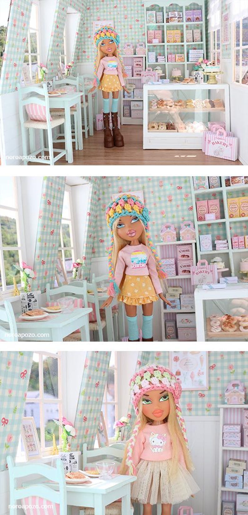 K&ouml;nnte beinhalten: Eine Puppe in einer Miniatur-B&auml;ckerei-Szene. Die Puppe tr&auml;gt ein rosa Oberteil, einen gelben Rock und einen bunten Hut. Die Szene umfasst eine Vitrine mit Geb&auml;ck, Regale mit Schachteln sowie einen kleinen Tisch und St&uuml;hle.