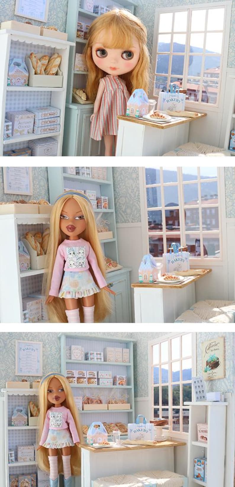 May include: A dollhouse bakery scene featuring a blonde doll in a pink long-sleeve shirt and patterned skirt, standing in a miniature shop with light blue shelves, white counters, and various tiny bakery items including boxes labeled Bakery.