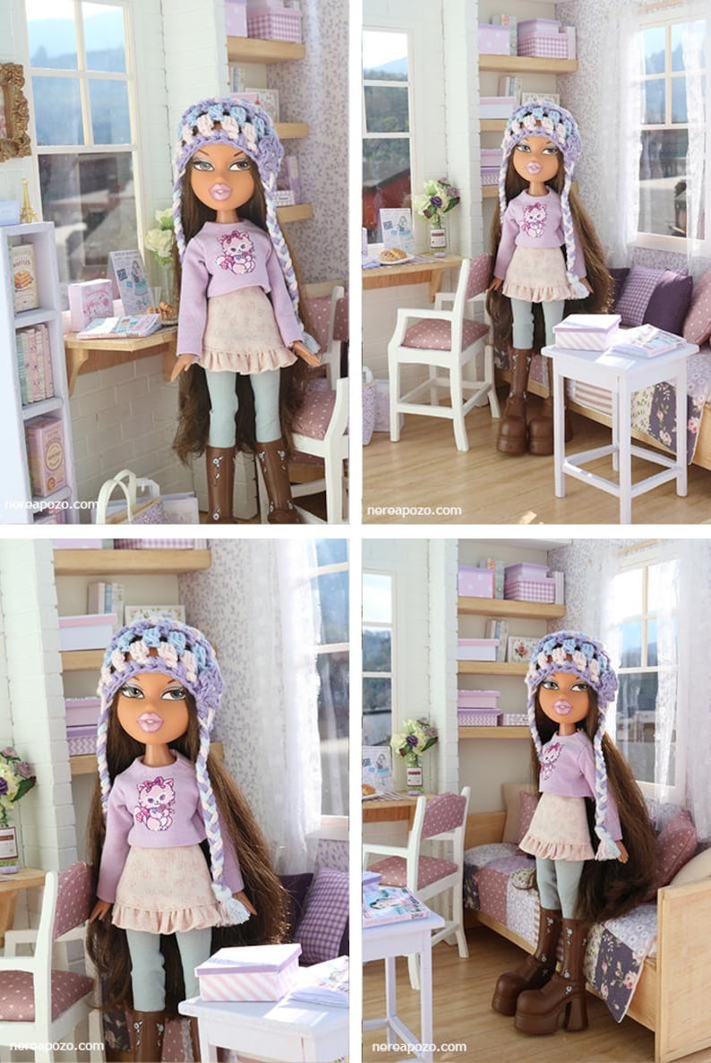 Pode incluir: Boneca Bratz vestindo um su&eacute;ter lil&aacute;s com um desenho de gato, uma saia com babados e um chap&eacute;u de croch&ecirc;. A boneca tem cabelo castanho comprido e botas de plataforma marrons. A boneca est&aacute; em um quarto em miniatura.