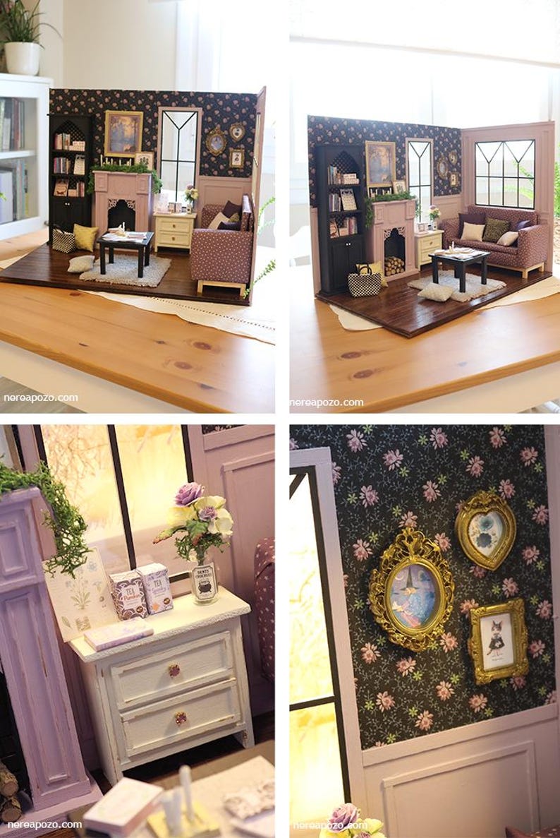 May include: A miniature dollhouse living room set featuring a black bookshelf, a lavender fireplace, a patterned sofa, a coffee table, and a white nightstand. The walls have dark floral wallpaper and gold-framed wall art.