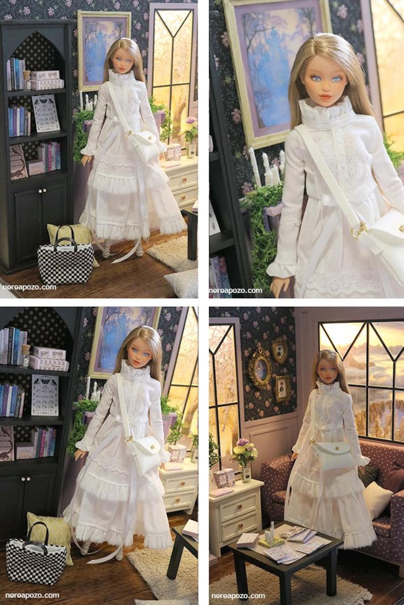May include: A blonde doll wearing a long-sleeved white dress with a ruffled collar, lace detailing, and a tiered skirt. The doll carries a white crossbody bag with a gold clasp. The text "nereapozo.com" is visible in the bottom corners.