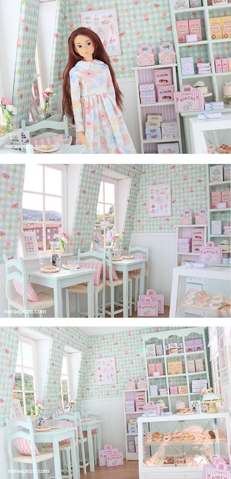 K&ouml;nnte beinhalten: Eine Miniatur-B&auml;ckerei-Szene mit einer Puppe in einem Blumenkleid. Der Raum verf&uuml;gt &uuml;ber eine pastellgr&uuml;ne und rosa Einrichtung, darunter karierte Tapeten, Vorh&auml;nge und M&ouml;bel. Regale zeigen Schachteln und Backwaren, mit einer Vitrine voller Geb&auml;ck.