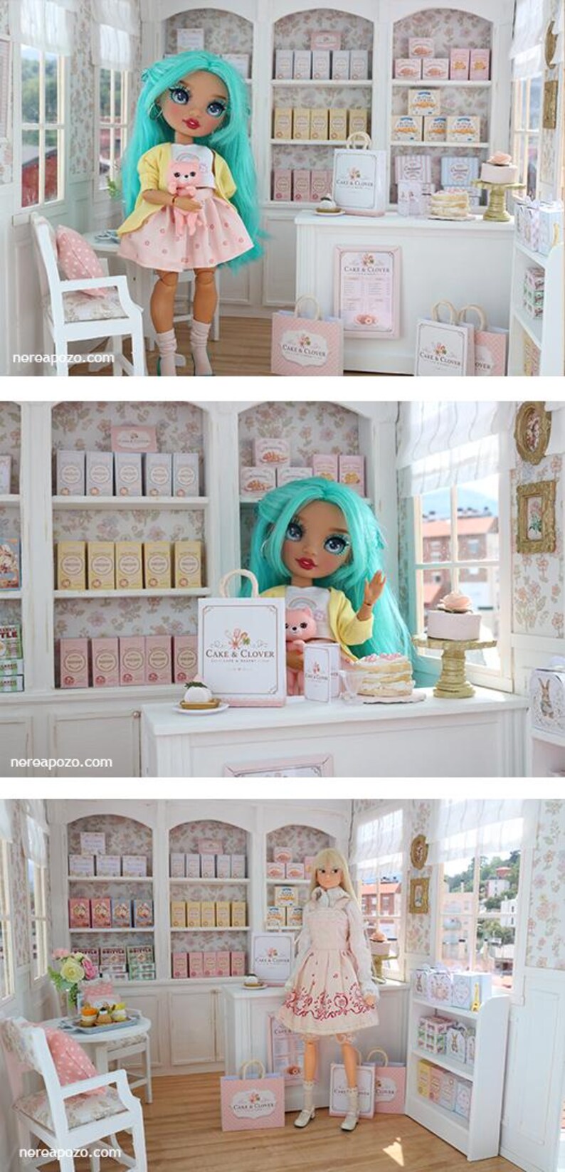 K&ouml;nnte beinhalten: Eine Miniatur-B&auml;ckerei-Szene mit einer Puppe mit t&uuml;rkisfarbenem Haar, die eine gelbe Strickjacke und einen rosa Rock tr&auml;gt und eine kleine rosa Katzenfigur h&auml;lt. Der Laden umfasst wei&szlig;e Regale mit Schachteln, eine Theke und kleine Torten.