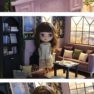 May include: A miniature dollhouse living room featuring a doll with brown hair, a cream-colored dress with lace trim, a purple fireplace mantel with green moss and white candles, a black bookshelf, a purple sofa with pillows, and a small table.
