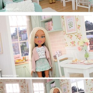 May include: A white ceramic mug with a black handle and the text "But First, Coffee" in a bold, black font. The mug is likely 325 ml in size and sits on a white surface.