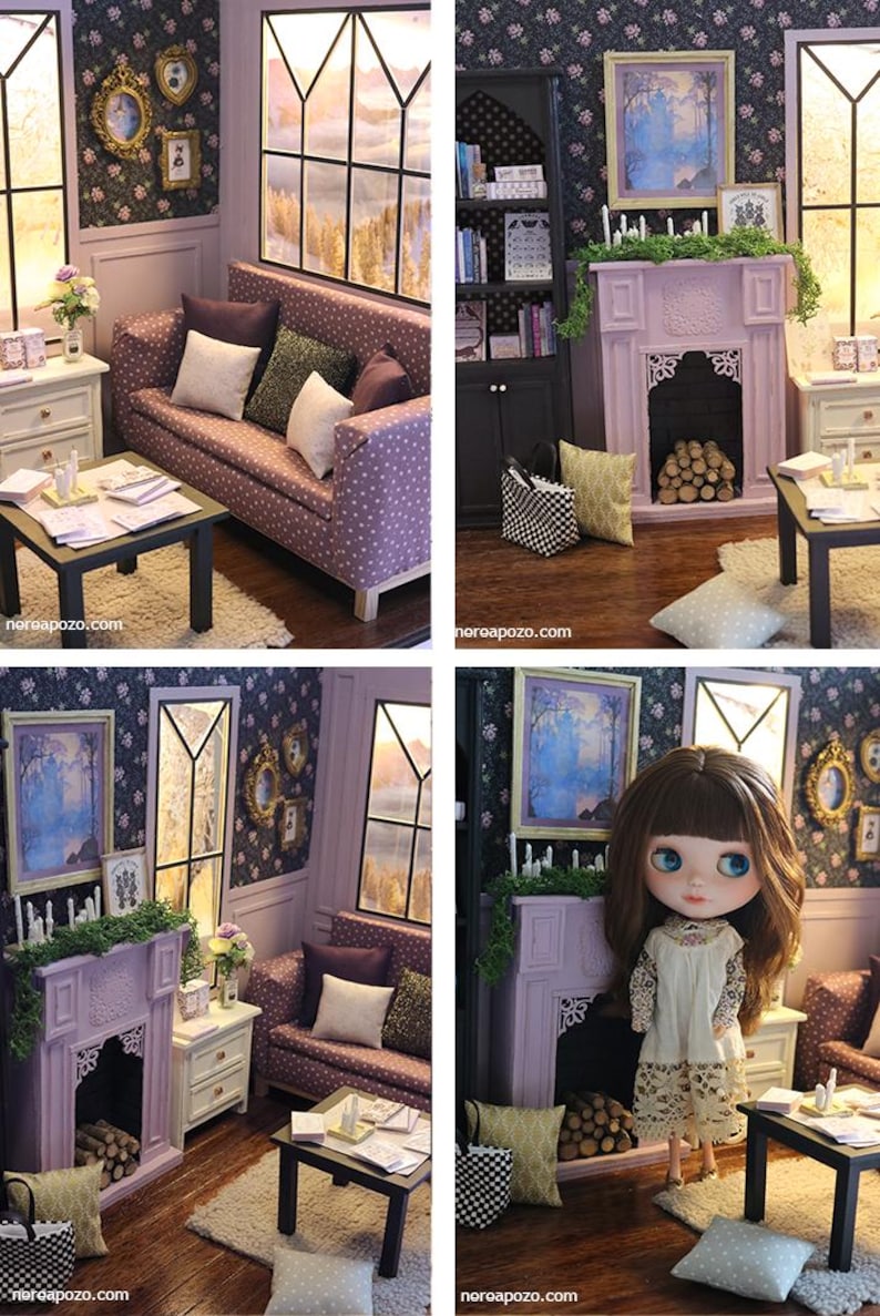 May include: A miniature dollhouse living room set featuring a purple polka dot sofa with throw pillows, a black coffee table, a lavender fireplace with logs, a black bookshelf, and a doll with brown hair wearing a cream lace dress.