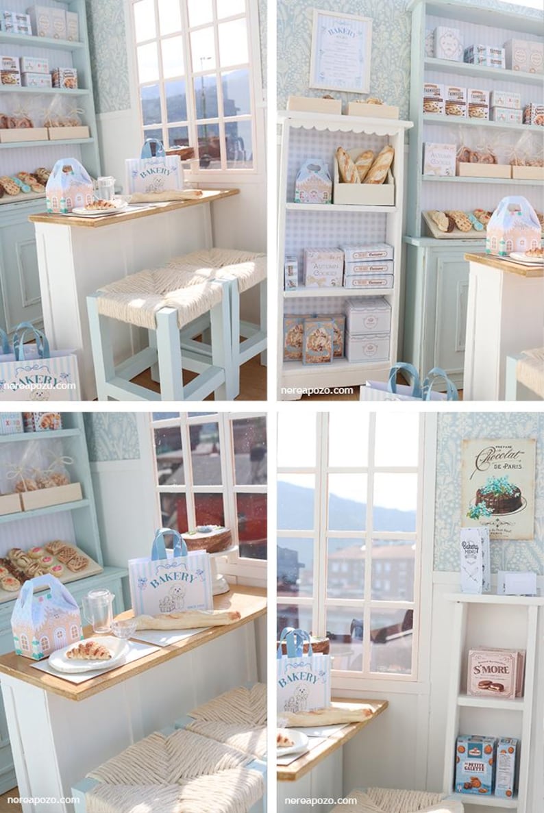 May include: A miniature bakery scene featuring light blue wooden shelves, a counter with a wooden top, and two stools with woven seats. The shelves are stocked with small boxes, bags, and baked goods. A sign reads Chocolat de Paris.