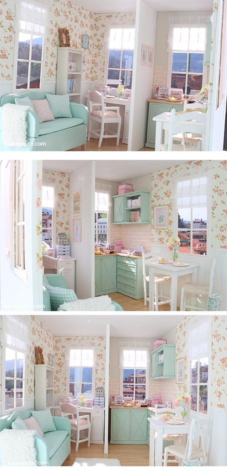 May include: A miniature dollhouse interior with a living room, kitchen, and dining area. The rooms feature floral wallpaper, mint green furniture, and white accents. The windows offer a view of the outside.