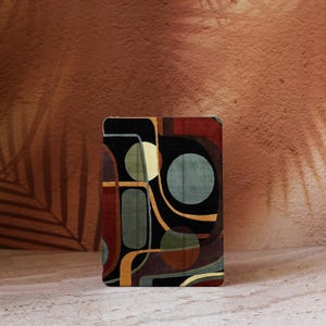 May include: A set of three ceramic mugs with a speckled, matte finish. The mugs are in shades of cream, light gray, and dark gray. Each mug has a simple, modern design and a rounded handle. Perfect for coffee or tea.