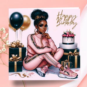 May include: A birthday card illustration showing a woman in a pink tracksuit, trainers, and gold jewellery. The card includes black and gold balloons, wrapped gifts, and a cake. The words "Happy Birthday" are written in gold script.