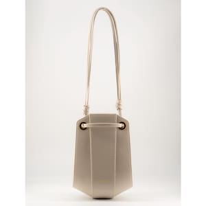 Beige Leather Bucket Bag: Minimalist Crossbody with Gold Hardware