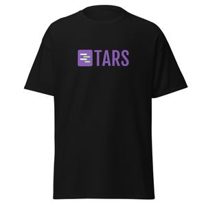 May include: Black t-shirt with a purple square logo that says "TARS" and has three green lines inside the square.