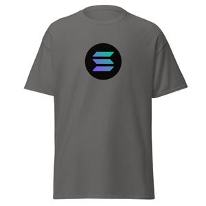 May include: A dark gray t-shirt with a black circle containing a stylized, multi-colored letter "S" in the center.
