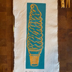 Jolly Kone, Turquoise and Dark Orange on handmade paper made from recycled shredded IEPs.