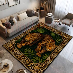 May include: A rectangular area rug featuring two leopards resting amidst dark green tropical foliage. The rug is framed by an ornate gold border with floral motifs and small bird illustrations, set against a deep black background.