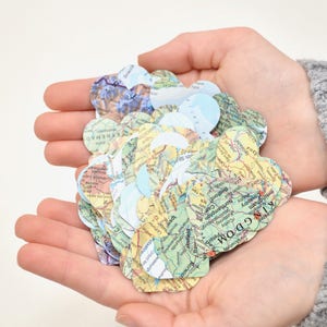Vintage Map Heart Confetti. Created using world atlases, each heart is 1.5" wide and has images on both sides. Perfect table confetti.