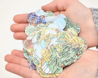 Vintage Map Heart Confetti. Created using world atlases, each heart is 1.5" wide and has images on both sides. Perfect table confetti.