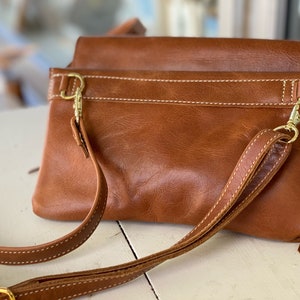 The Path Less Traveled cross body purse. Adjustable strap. Two leather colors.