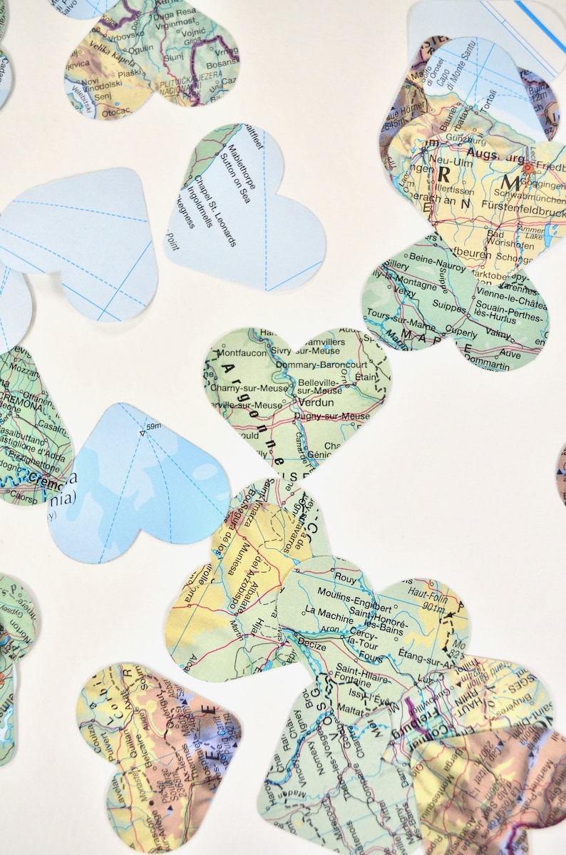 Vintage Map Heart Confetti. Created using world atlases, each heart is 1.5" wide and has images on both sides. Perfect table confetti.