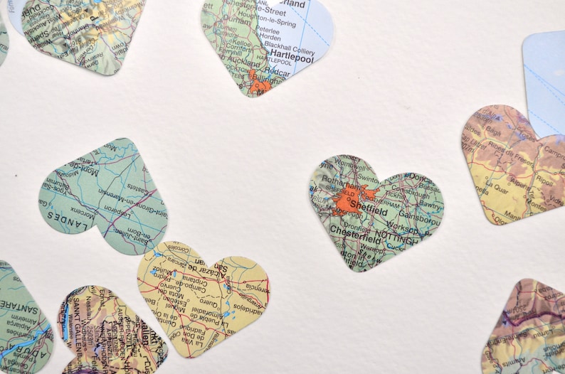 Vintage Map Heart Confetti. Created using world atlases, each heart is 1.5" wide and has images on both sides. Perfect table confetti.