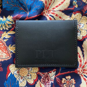 The Path Less Traveled Bi-Fold leather wallet. Choose from black, brown, or black with hair on Leppard print.