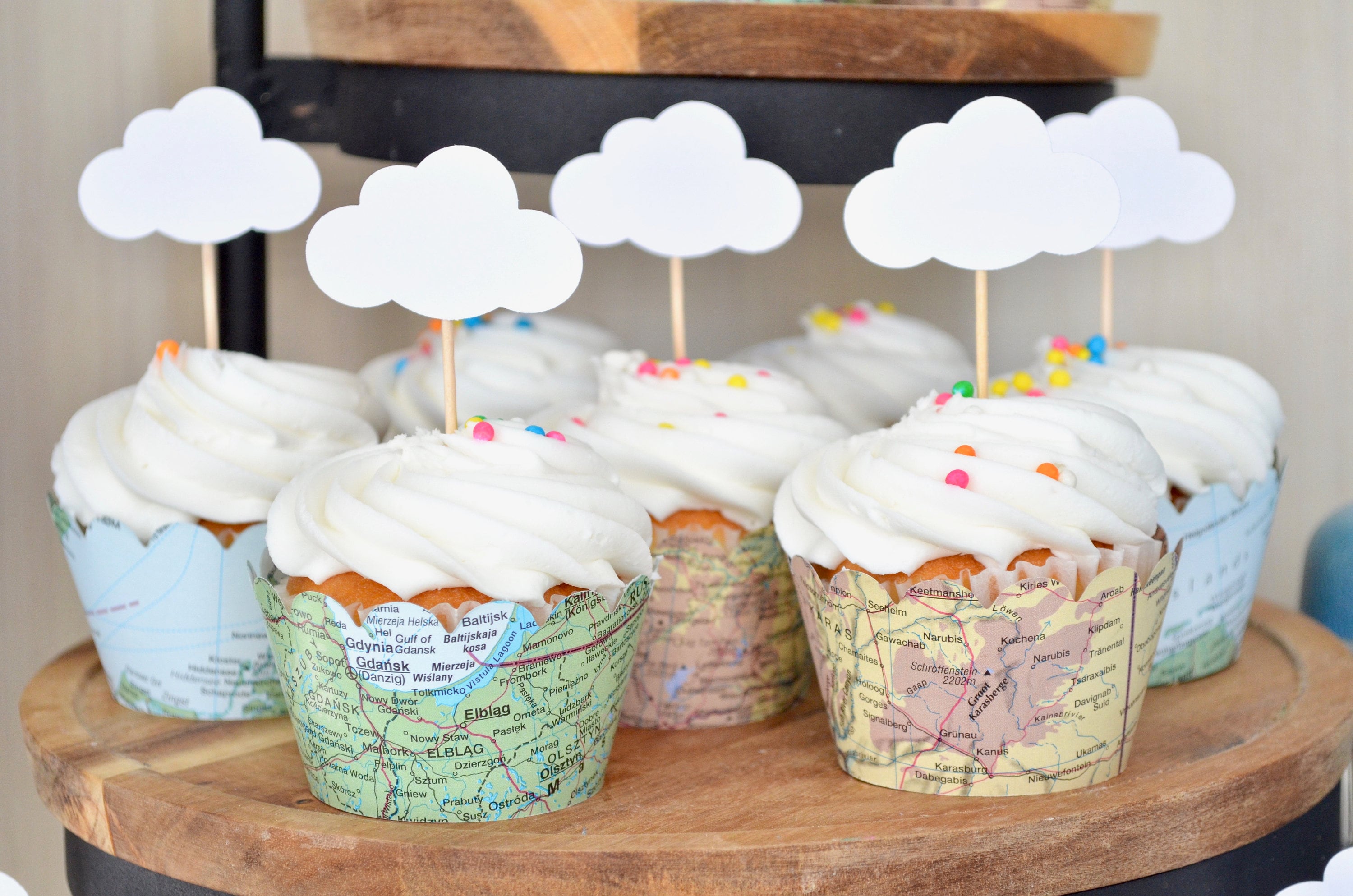 A cake made of paper, soft cardboard similar to a real sweet cake, suitable  for birthday parties. The theme features a rainbow and some clouds. The ca  Stock Photo - Alamy