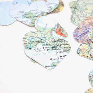 Vintage Map Heart Confetti. Created using world atlases, each heart is 1.5" wide and has images on both sides. Perfect table confetti.
