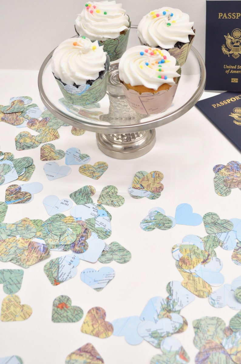 Vintage Map Heart Confetti. Created using world atlases, each heart is 1.5" wide and has images on both sides. Perfect table confetti.