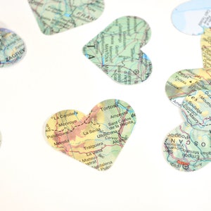 Vintage Map Heart Confetti. Created using world atlases, each heart is 1.5" wide and has images on both sides. Perfect table confetti.