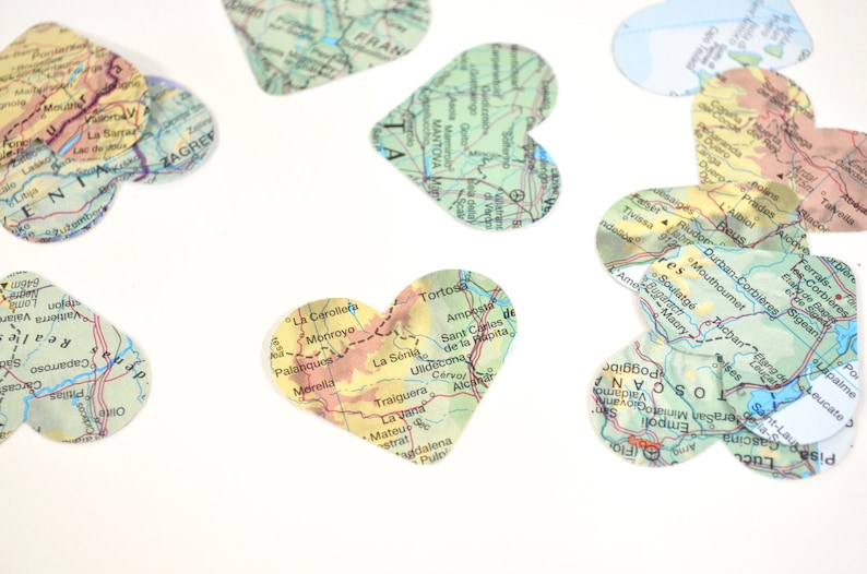 Vintage Map Heart Confetti. Created using world atlases, each heart is 1.5" wide and has images on both sides. Perfect table confetti.