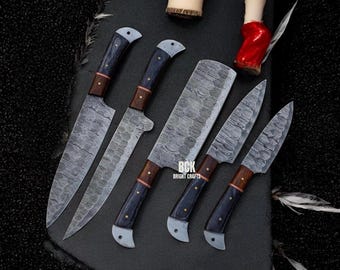 May include: Set of six kitchen knives with Damascus steel blades and wooden handles. The knives are arranged on a black surface with the brand name "BCK Bright Crafts" visible.