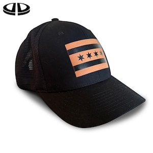 May include: Black baseball cap with a mesh back and a curved brim. The front features a rectangular patch with the Chicago flag design: three orange stripes and four black stars.