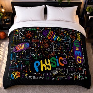 May include: A black duvet cover featuring a colorful, multi-patterned print of physics equations, scientific diagrams, and the words Physics, Gravity, Relativity, and E=MC2 in various bright colors. The bedding is displayed on a bed with white pillows.
