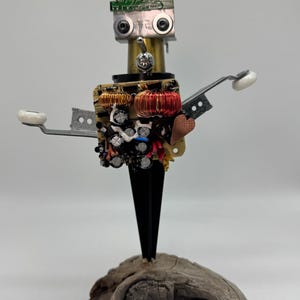 Maestro of the Grid, unique sculpture, mixed media artwork, recycled material, one of a kind art piece