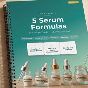 May include: A spiral-bound guide titled 5 Serum Formulas by Moish Organic, featuring a teal cover with text about DIY recipes, chemist verification, and ingredients like Niacinamide and Vitamin C, displayed with five small glass serum bottles.