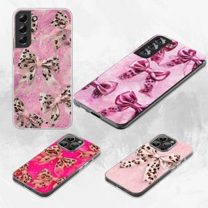 May include: Four phone cases with bow designs. The cases feature pink backgrounds with bows in various shades of pink and leopard print. The cases are for different phone models and have clear edges.