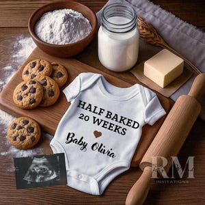 May include: A white baby onesie with the text "HALF BAKED 20 WEEKS Baby Olivia" is surrounded by baking ingredients. Chocolate chip cookies, flour, milk, and butter are arranged on a wooden surface, with a sonogram image.